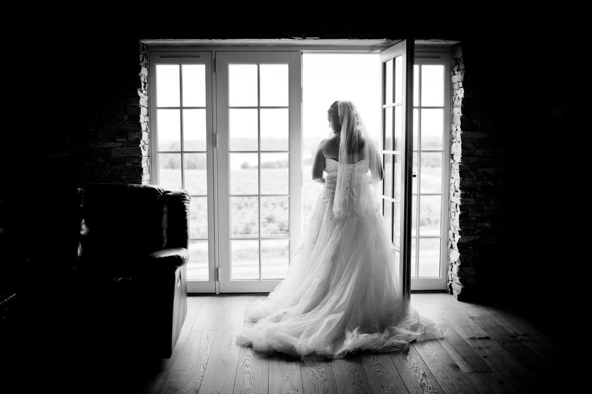 Grayscaled Photography of Woman Wearing Wedding Dress